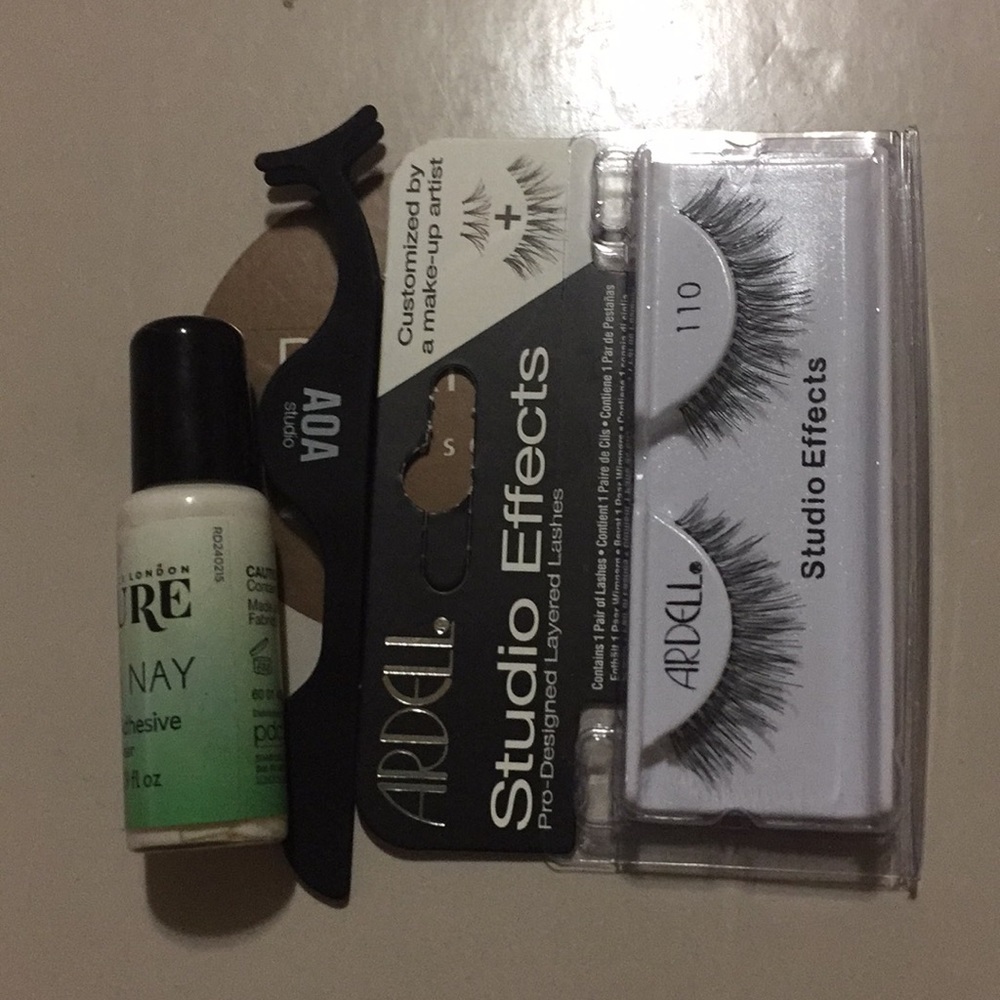 A pair of eye lashes strip lashes adhesive